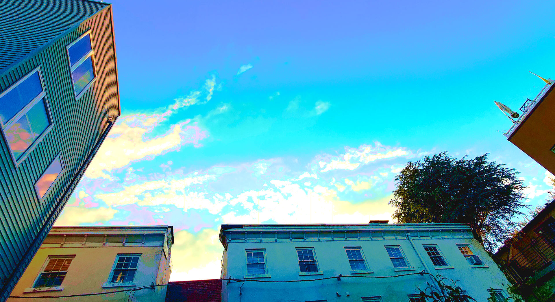 A view (from the ground looking to the sky) of a Philadelphia courtyard | part of a post on Philadelphia property assessments from Permit Philly